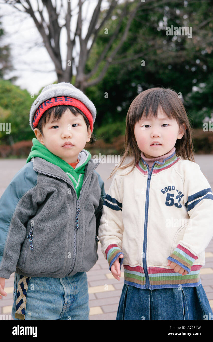 Portrait of boy and girl standing Stock Photo - Alamy