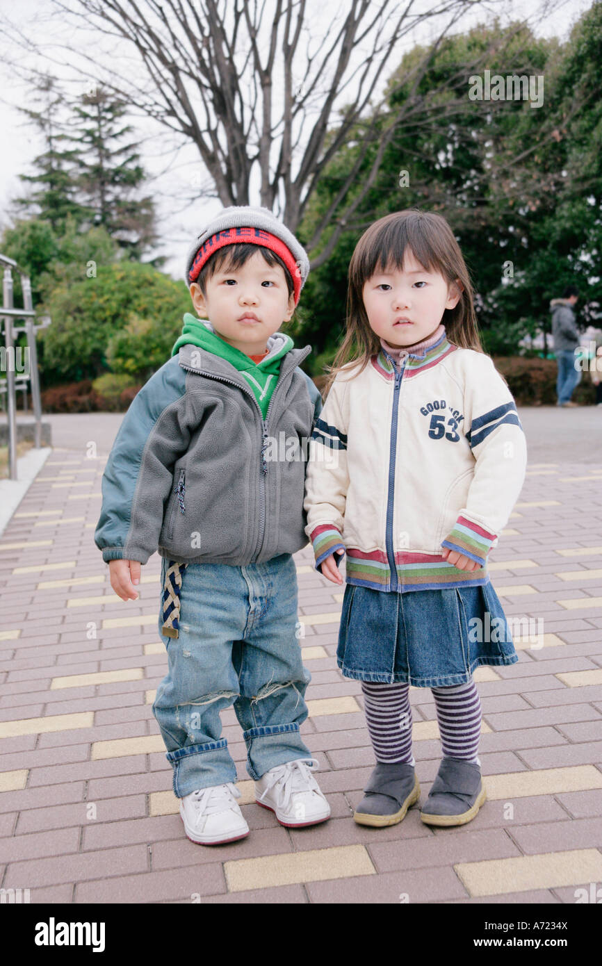 Portrait of boy and girl standing Stock Photo - Alamy