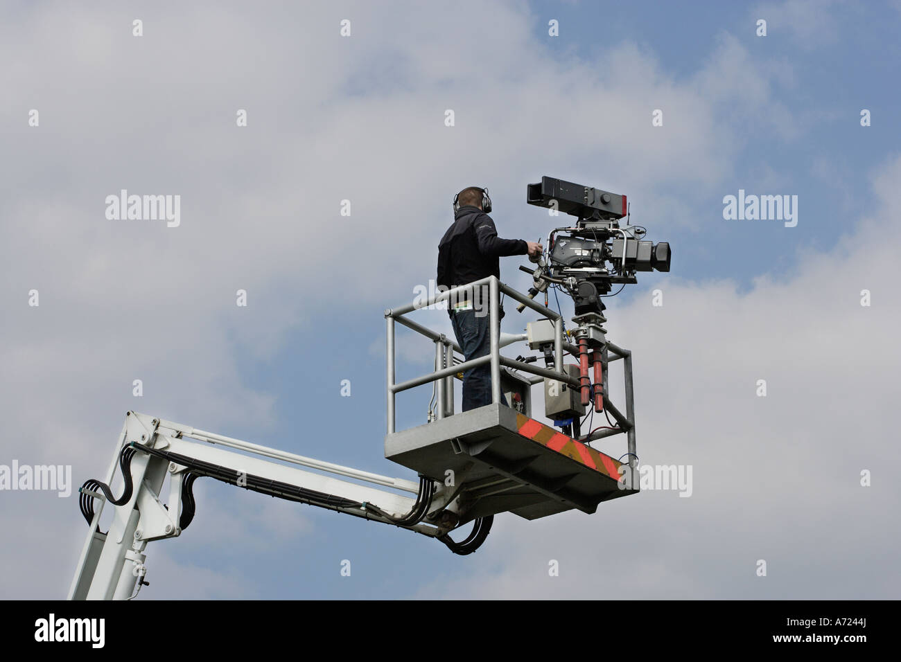 Television camera and cameraman on hydraulic platform Stock Photo