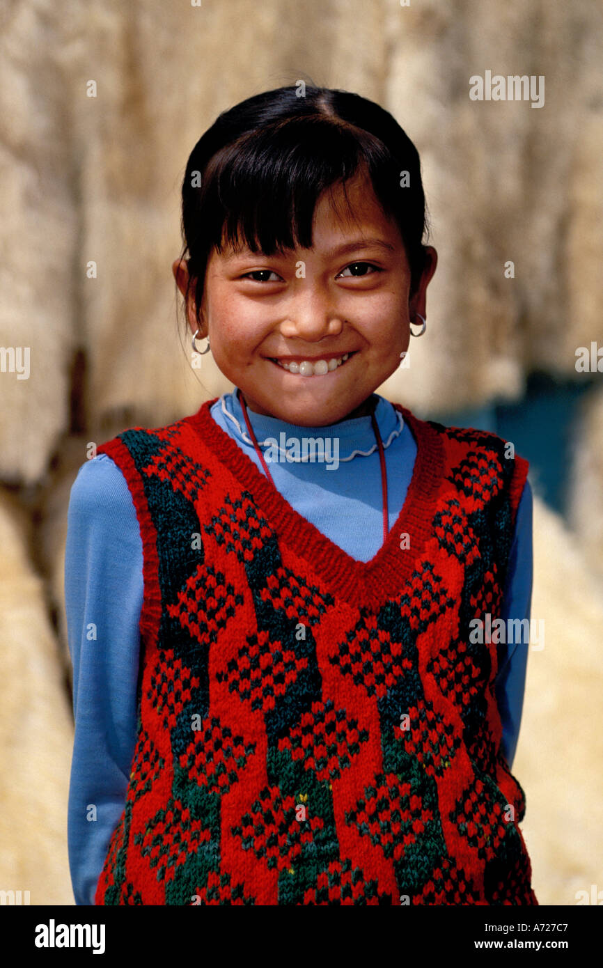 China, Gansu Province, Young girl and lambskins, Linxia Stock Photo