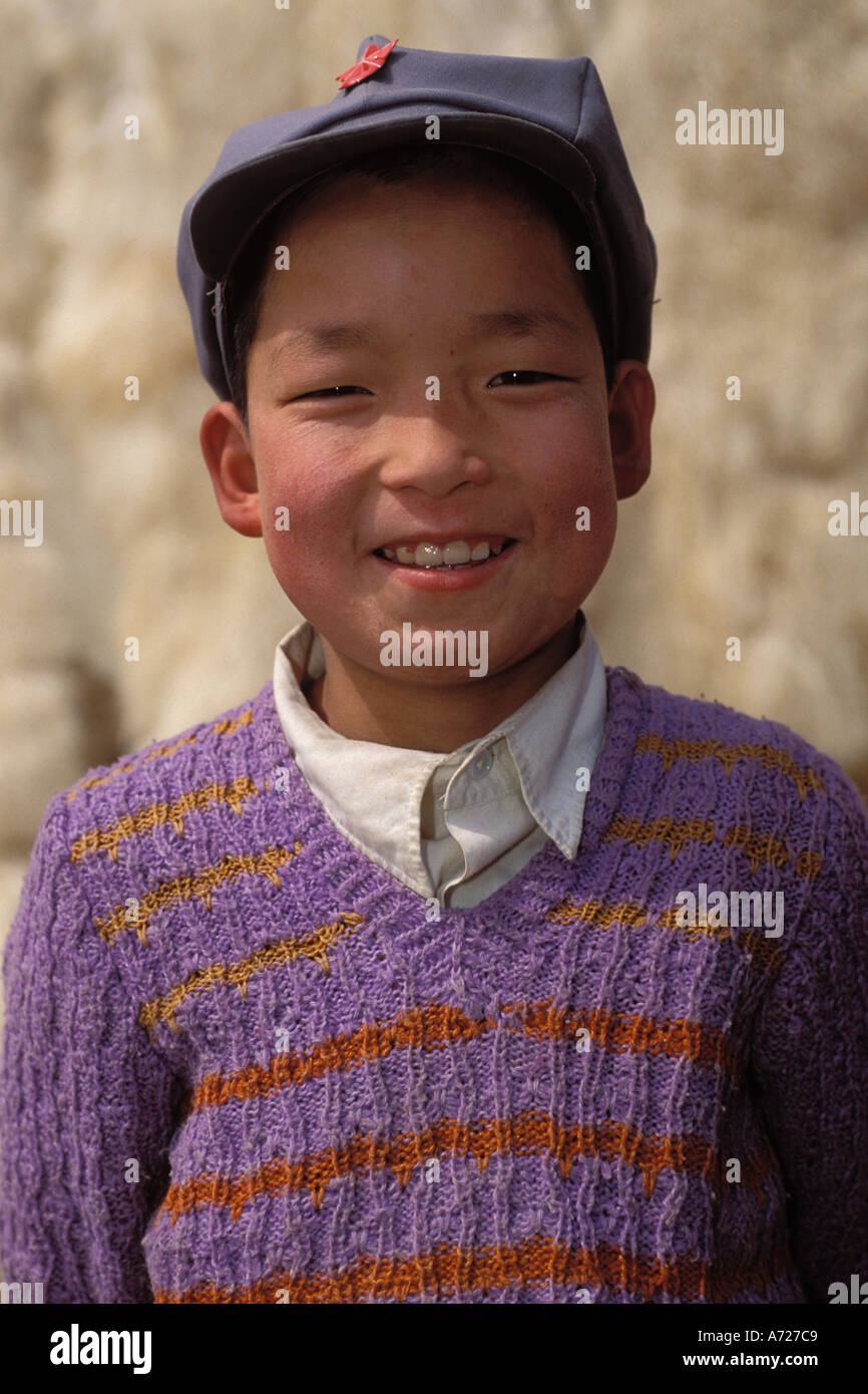 China, Gansu Province, Young boy and lambskins, Linxia Stock Photo