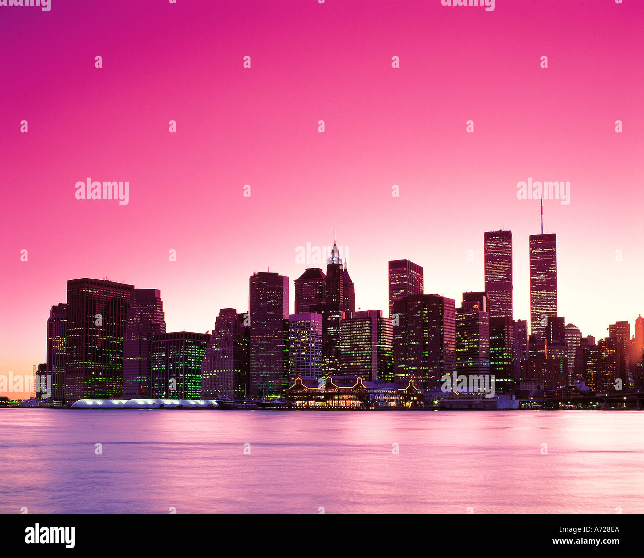 Lower Manhattan at night showing the East River New York City Stock ...