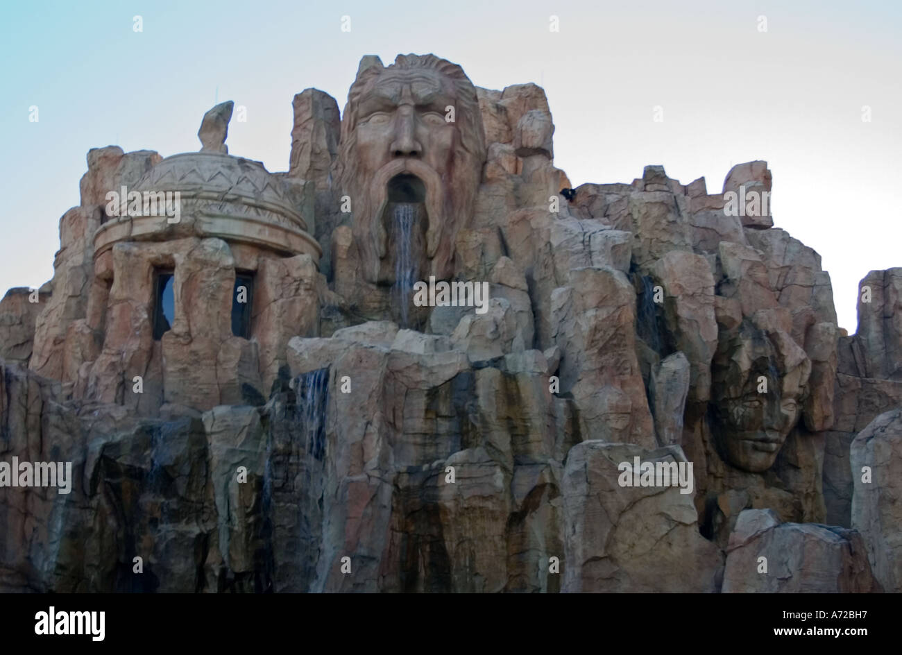 Fake rock formation with faces exterior of Poseidon s Fury temple