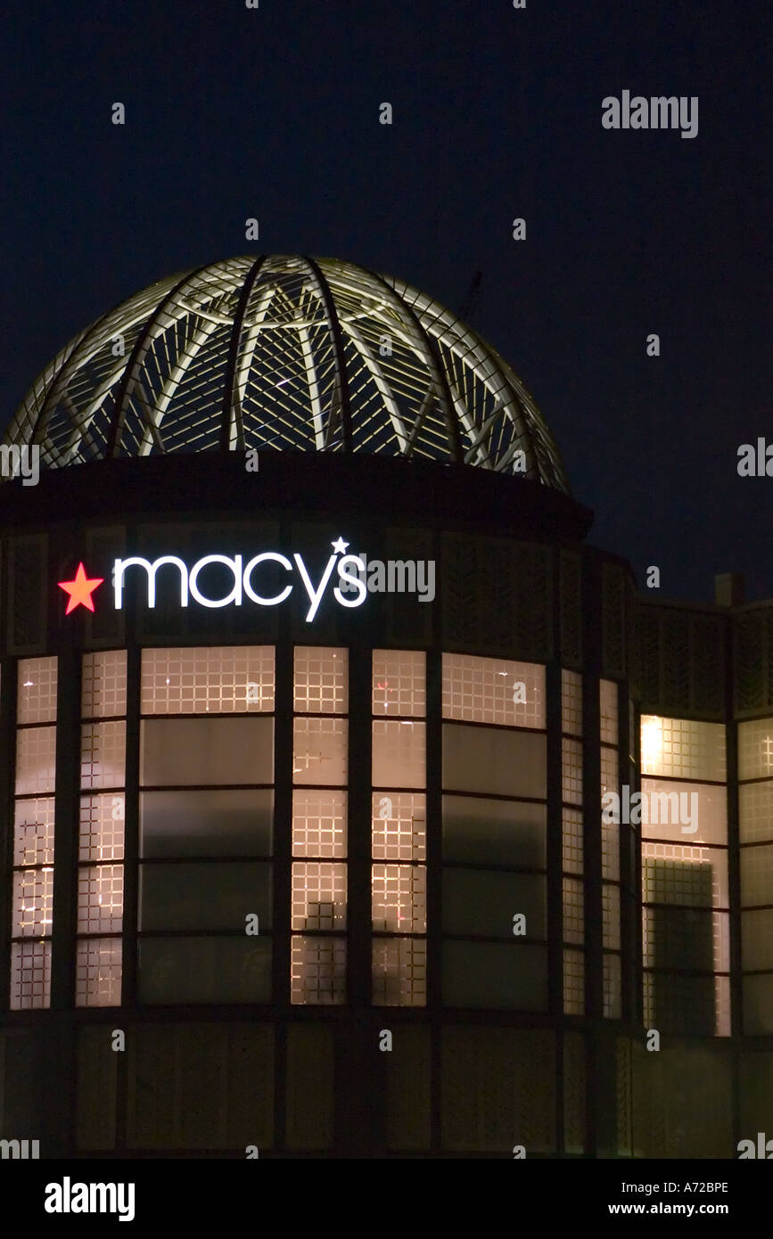 Closeup of illuminated Macy s department store at night City Place West