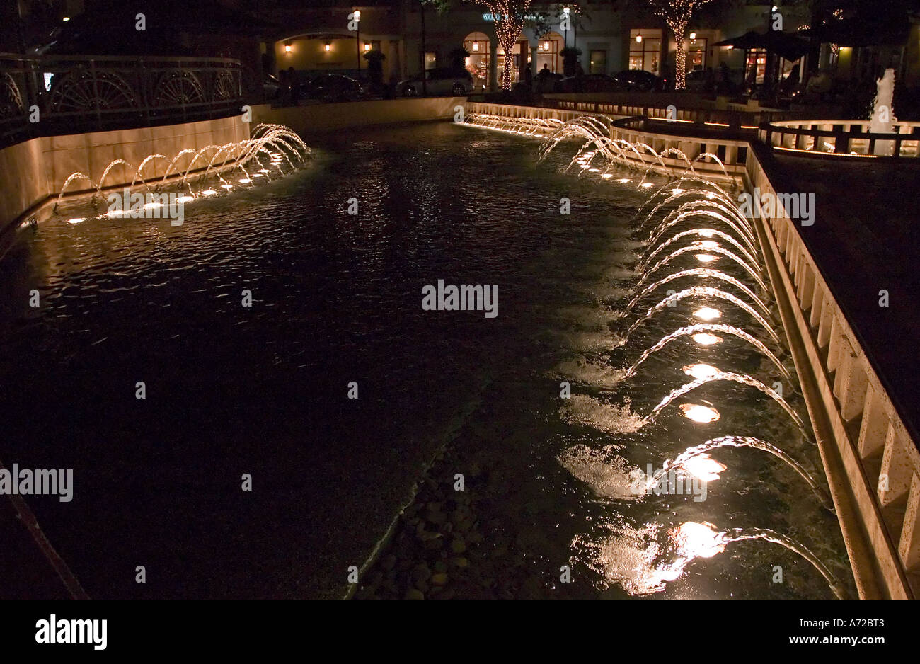 Night view of illuminated fountains in front of Il Bellagio restaurant City Place West Palm Beach Florida Stock Photo