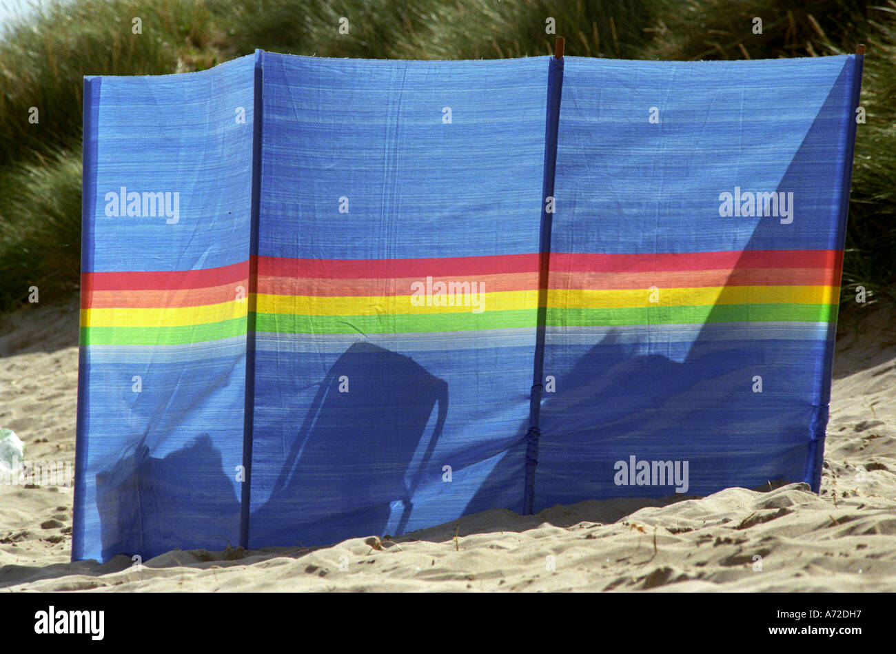 Windbreak Silhouettes; Cloth windbreak extended seashore wind shelter ...