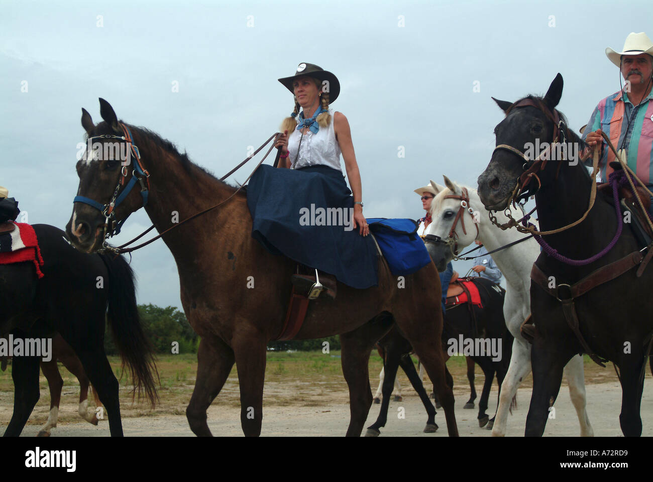 A cowgirl riding a horse in Bandera Texas Stock Photo Alamy