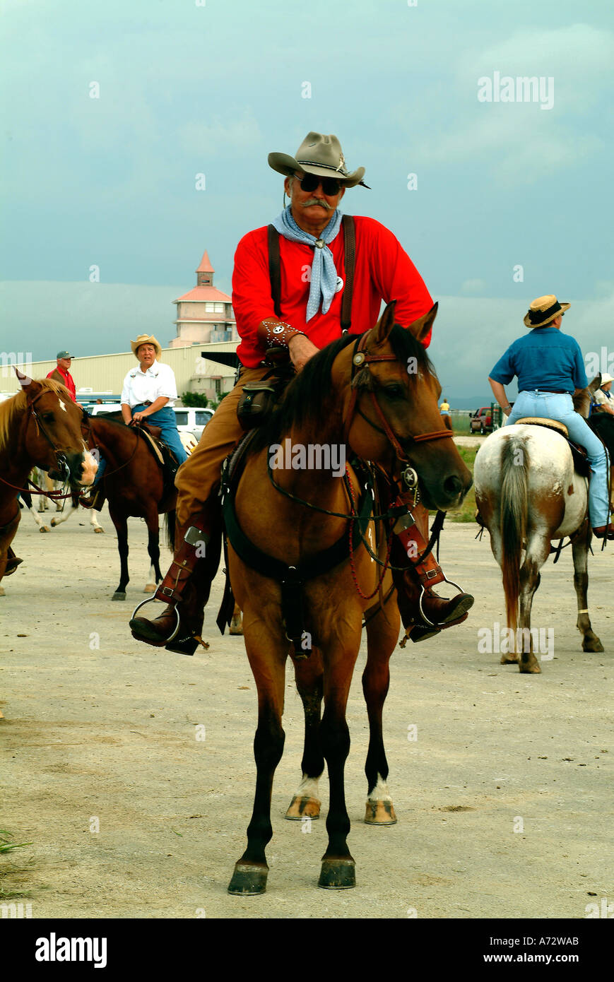 A cowboy riding a horse in Bandera Texas Stock Photo Alamy