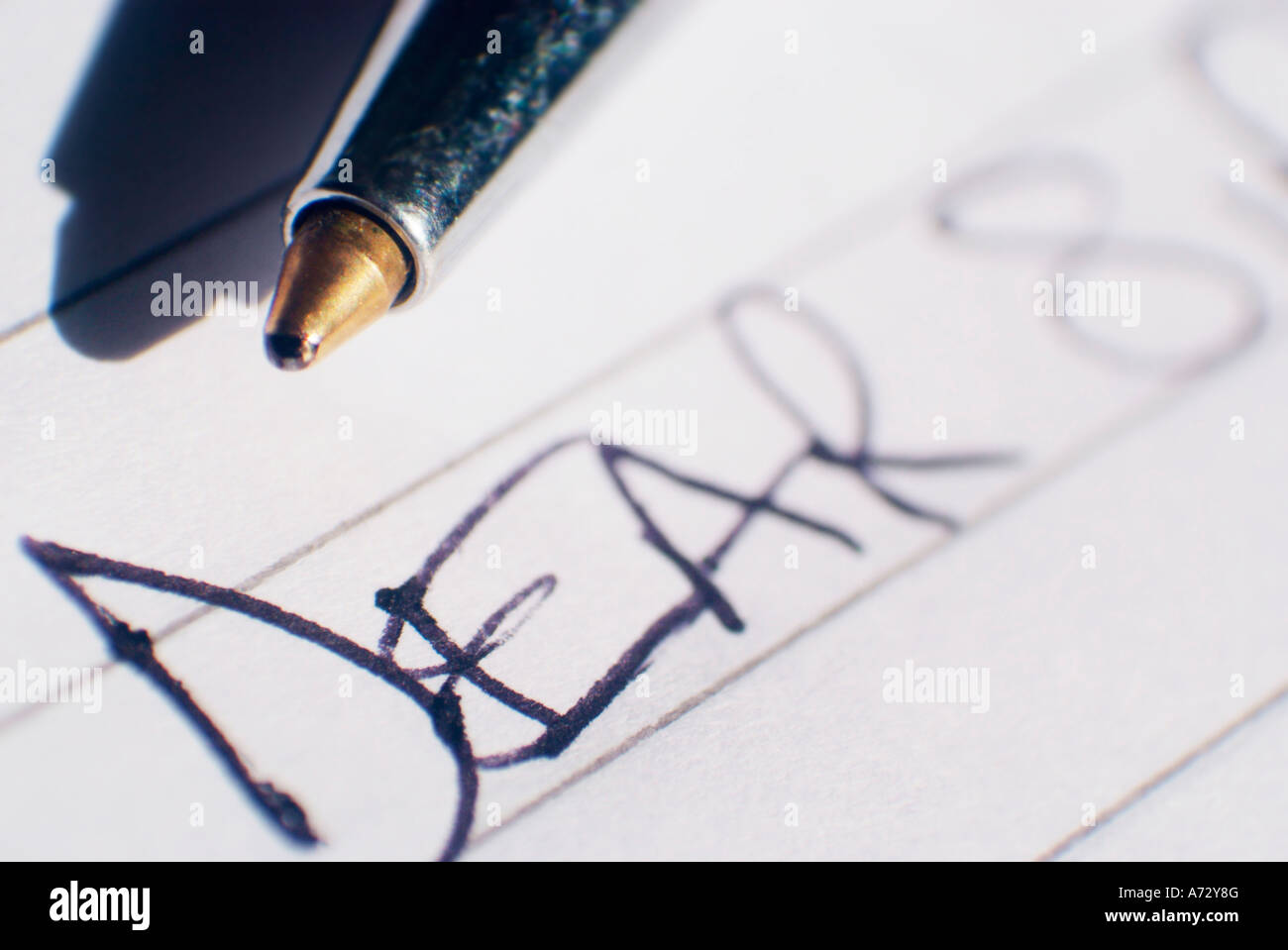 close up of a pen on ruled paper with the opening greeting dear sir Stock Photo