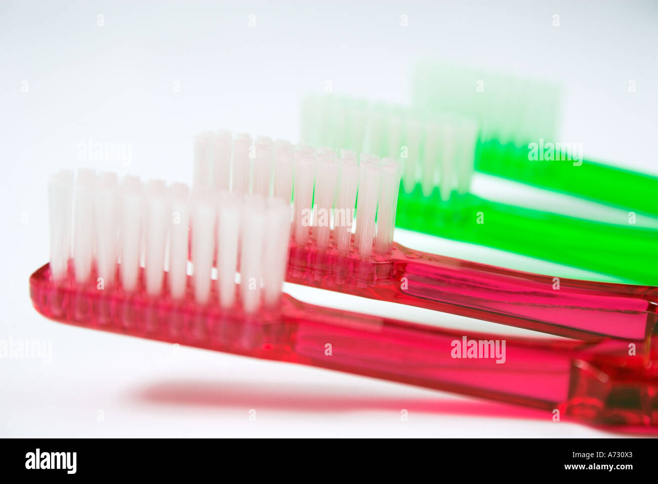 Toothbrushes on white background Stock Photo - Alamy