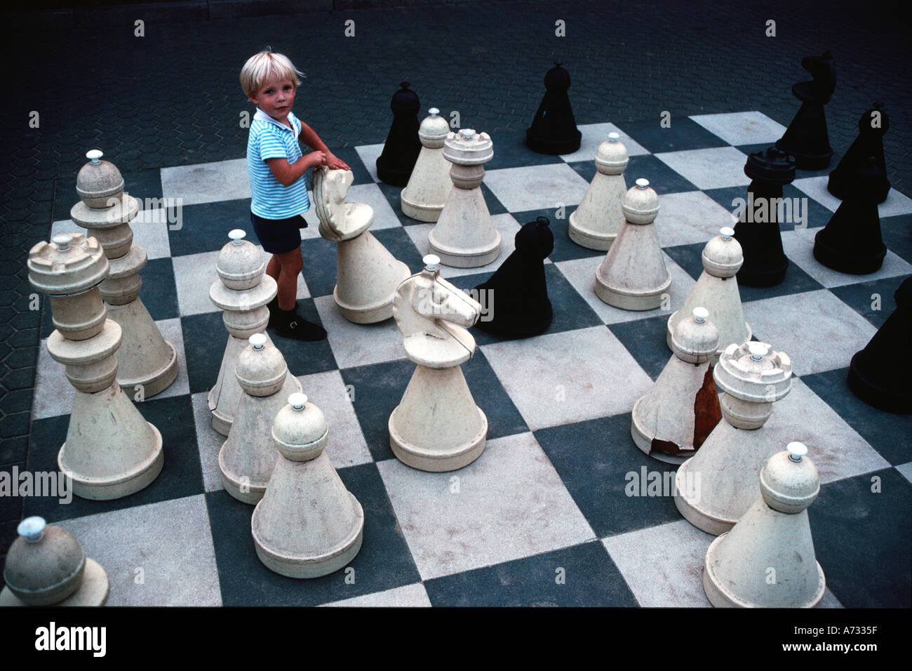 Children playing chess game on street with large size chess pieces and chess  board on street of Mile End in Le Plateau Mont Royal.Montreal.Quebec.Canada  Stock Photo - Alamy