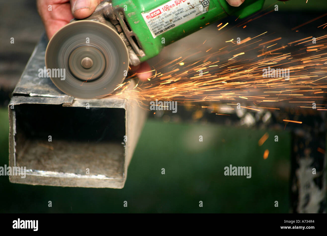 Cutting Steel with an angle grinder with sparks Stock Photo Alamy