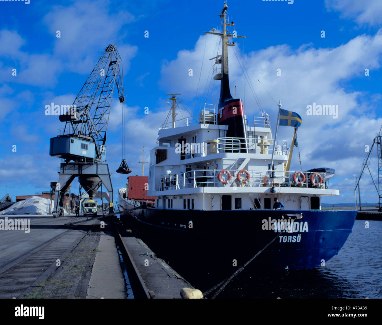 Unloading a freighter on the River Lidan, Lidköping, Skaraborg, Sweden. Stock Photo