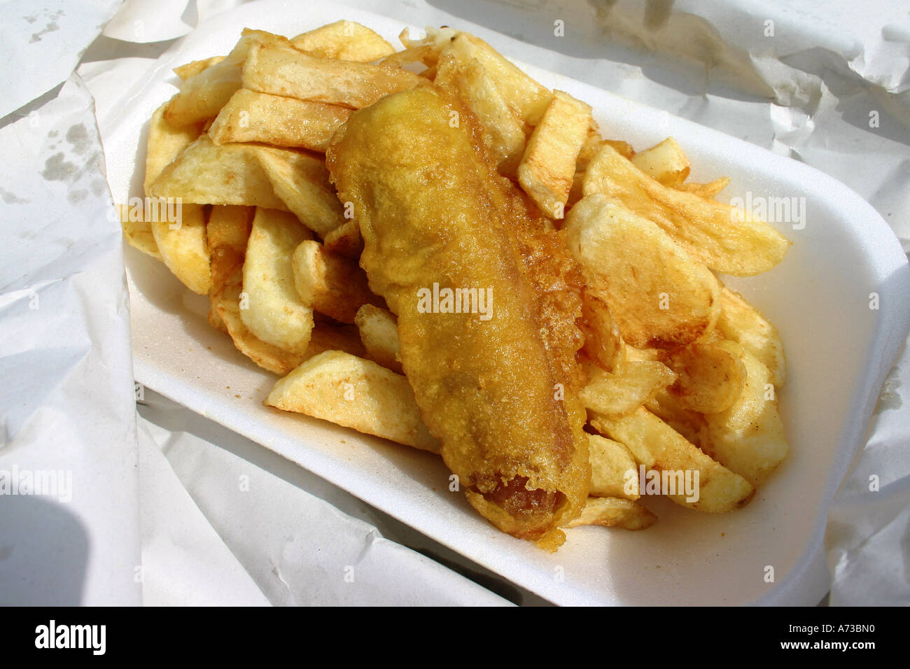 Battered sausage and chips Stock Photo Alamy