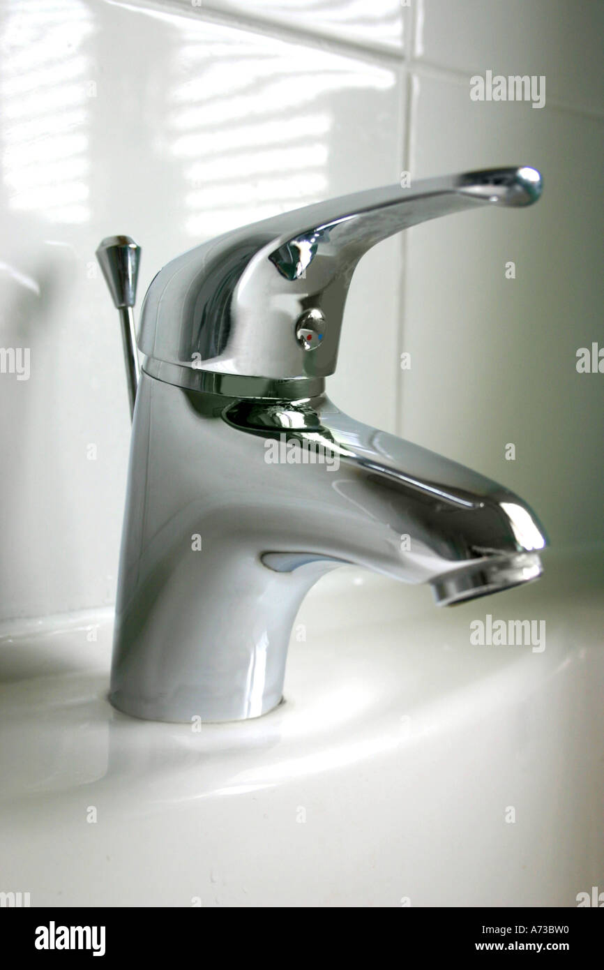 Tap on bathroom sink Stock Photo - Alamy