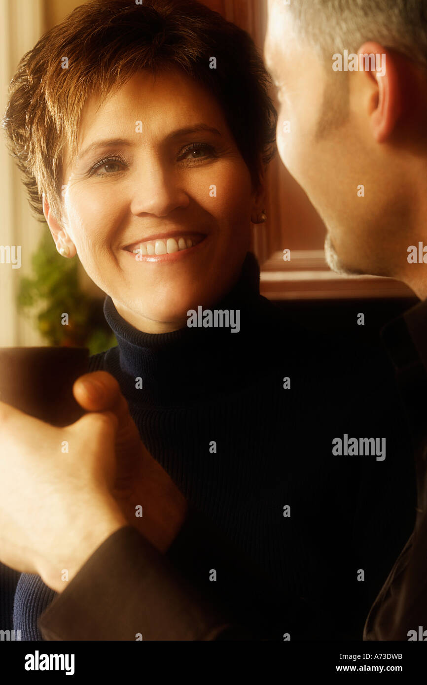 Man and woman conversing over coffee Stock Photo