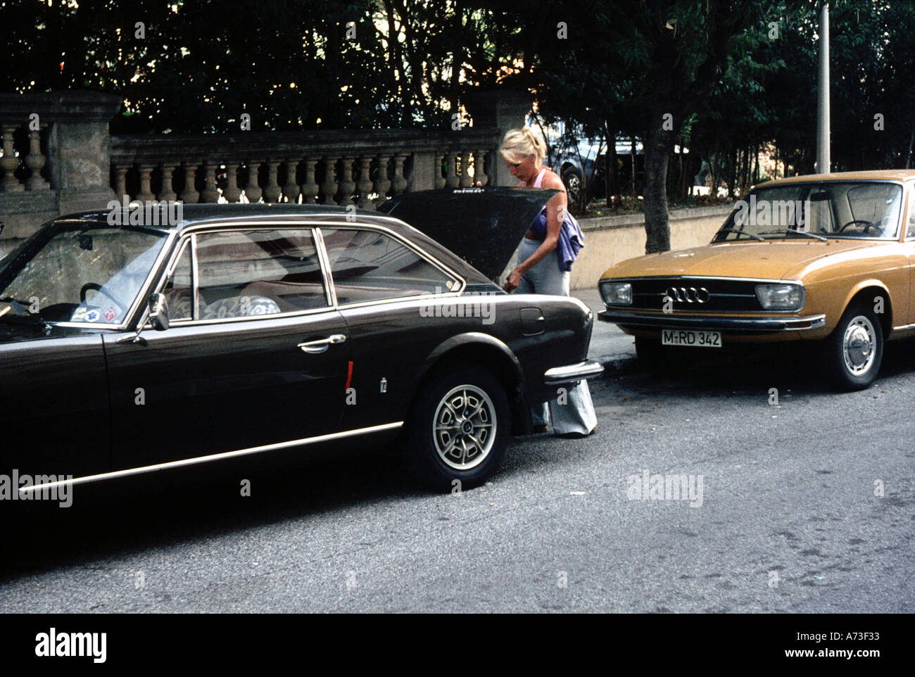 French girl with her Pininfarina designed Peugeot car Juan Les Pins South of France 1974 Stock Photo