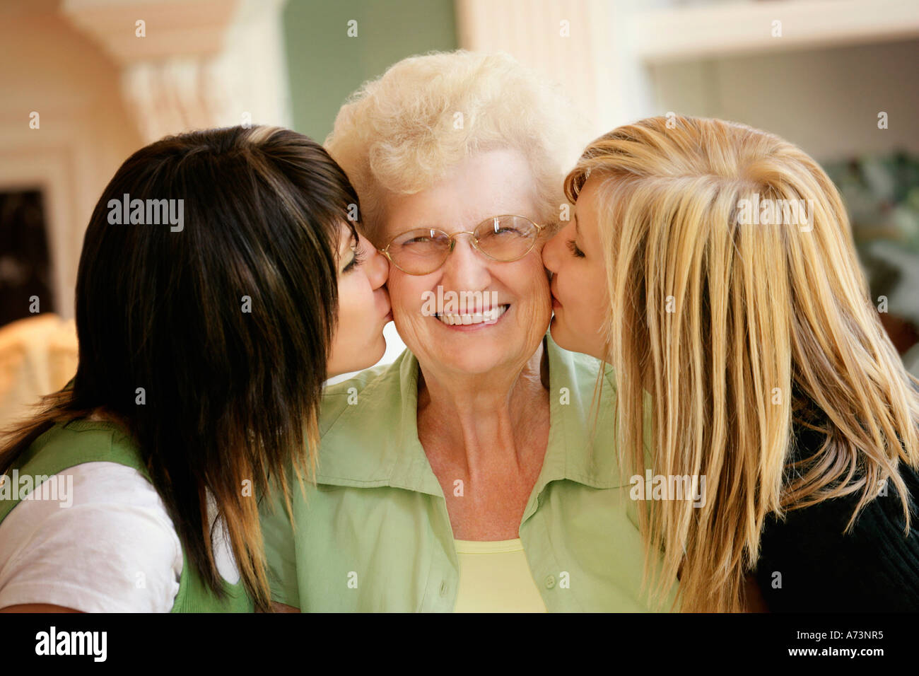 Grand Babes Kissing Grandmother Stock Photo Alamy