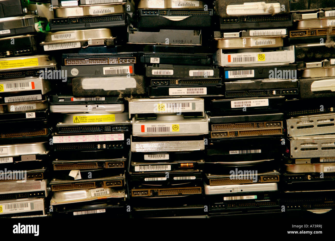 Computer hard drives ready for destruction and recycling of parts at