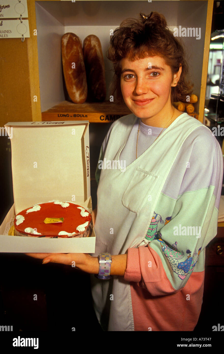 1, one, Frenchwoman, French woman, baker, employee, holding a cake, bakery, boulangerie, Saint-Vincent-de-Tyrosse, Aquitaine, France, Europe Stock Photo