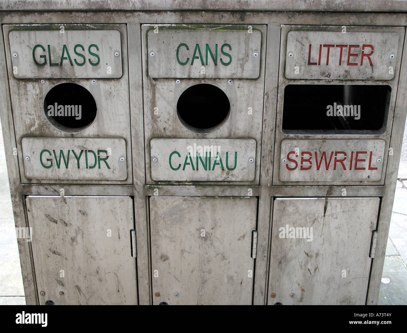 Bilingual Welsh English language street rubbish bin for glass cans and