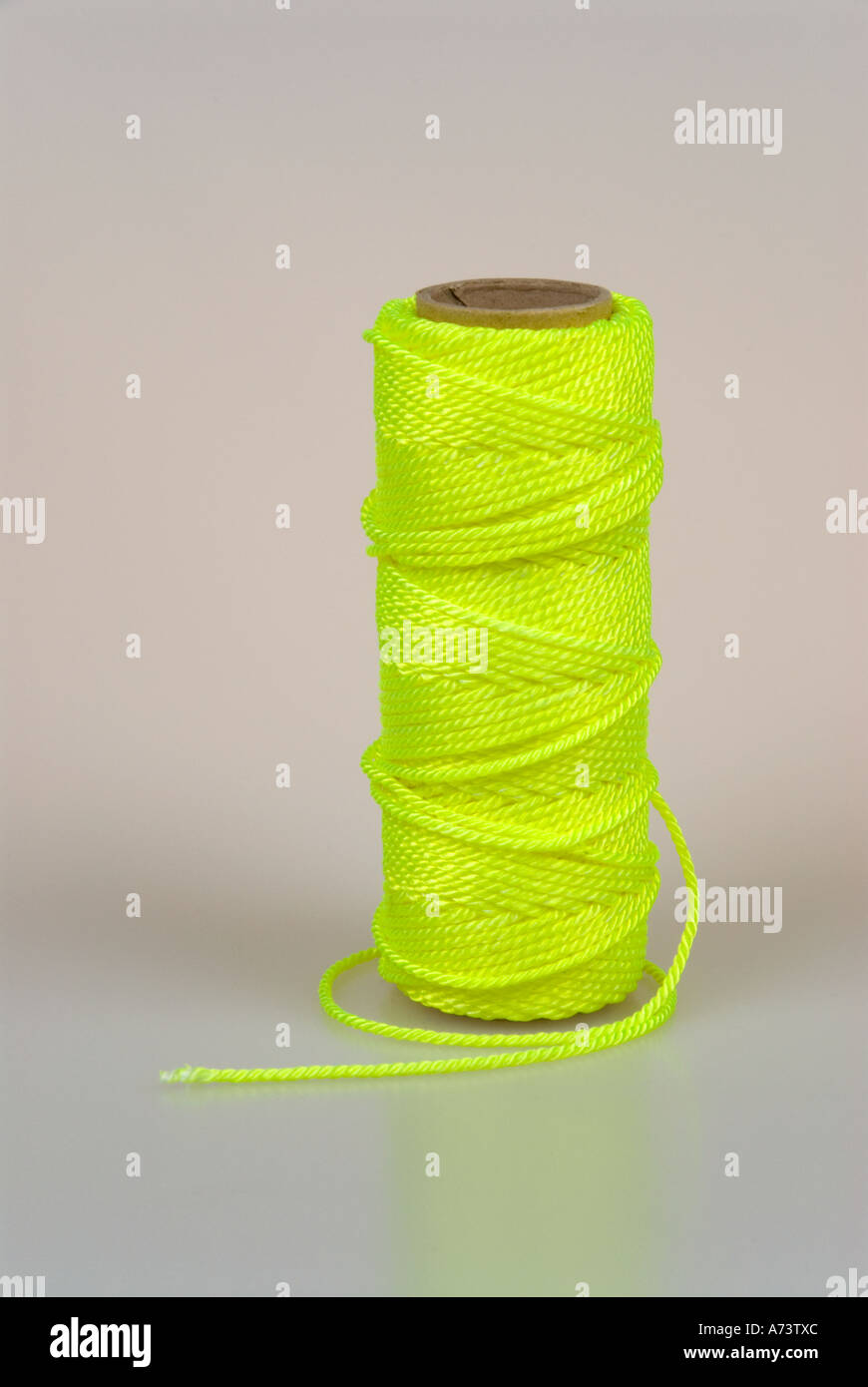 Download A Reel Of Yellow String Against An Off White Background Vertical Stock Photo Alamy PSD Mockup Templates