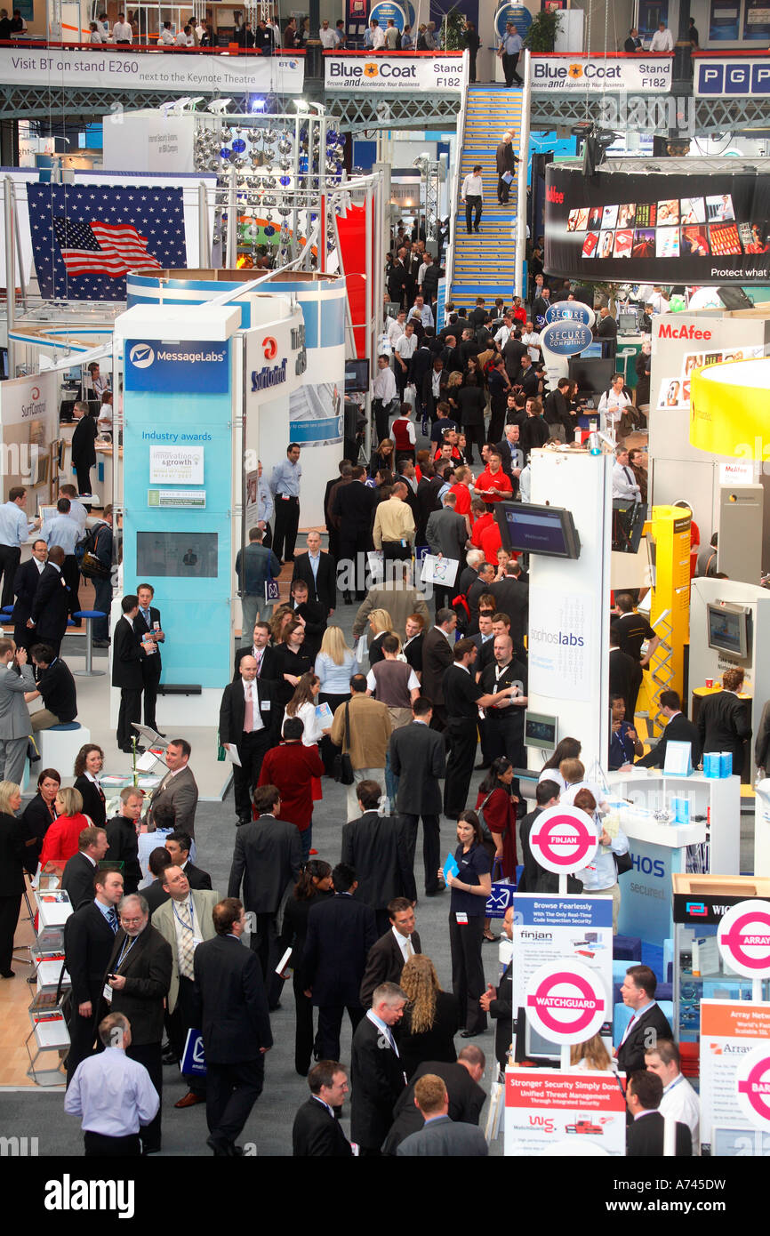 Busy aisle at trade show or exhibition showing men and women doing business Stock Photo
