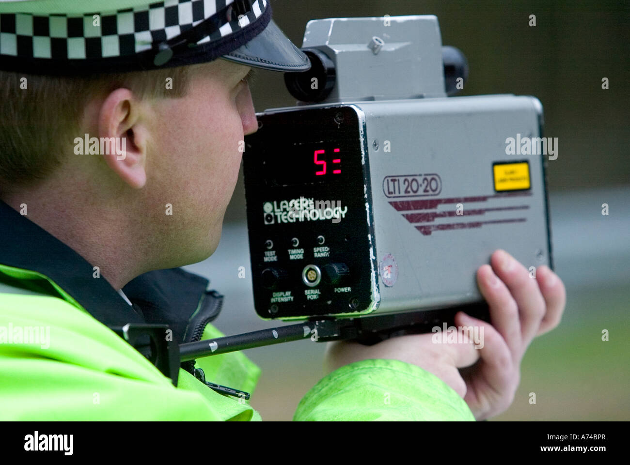 British Police use a speed trap laser camera to catch speeding motorists Stock Photo
