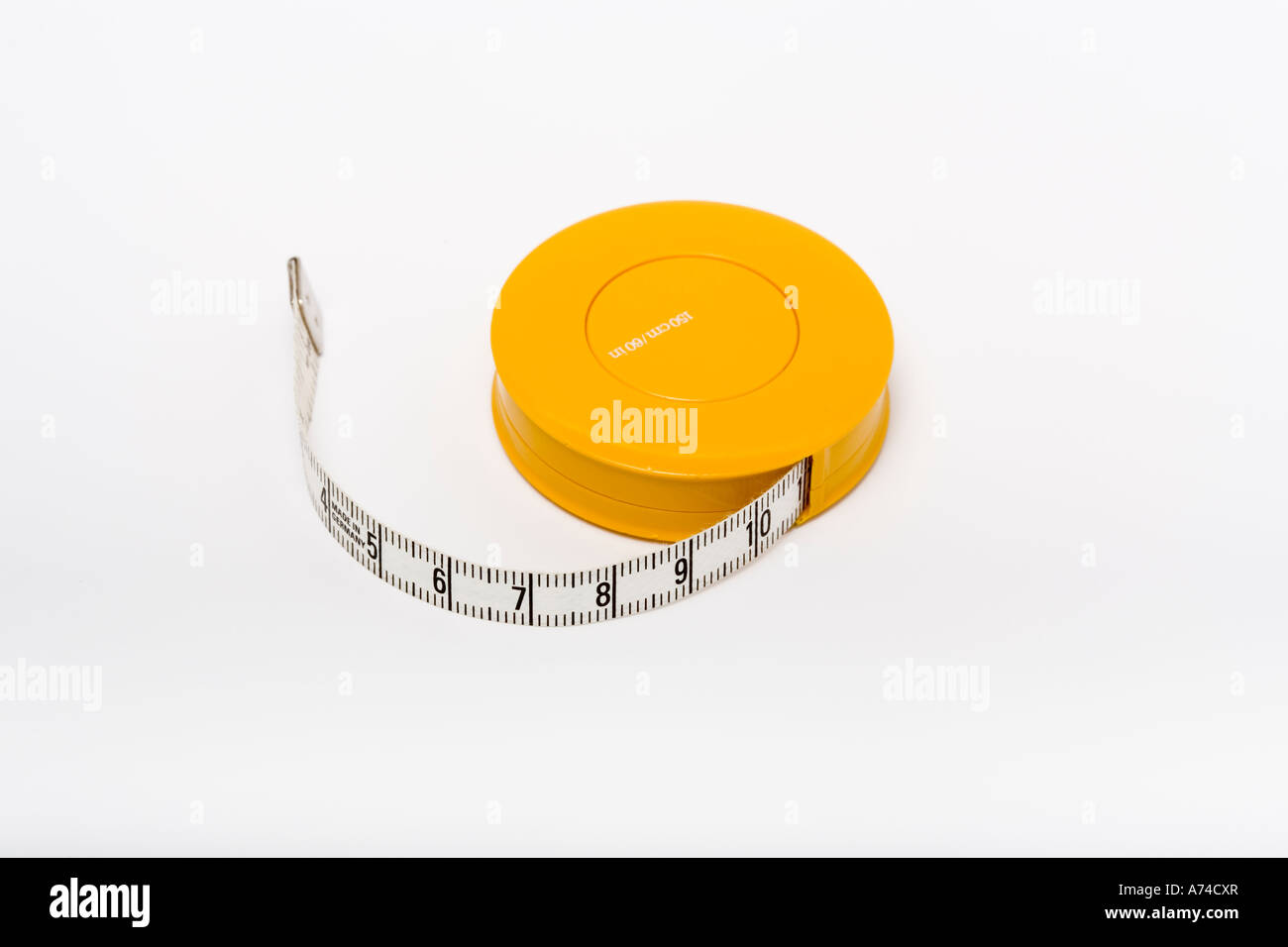 Yellow measuring tape on white background Stock Photo - Alamy
