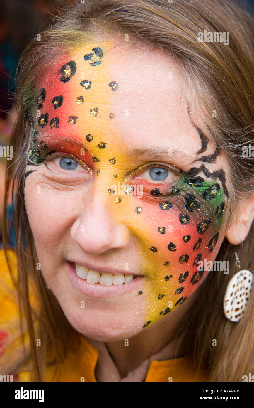 Artistic face painting on young woman with smile Stock Photo - Alamy