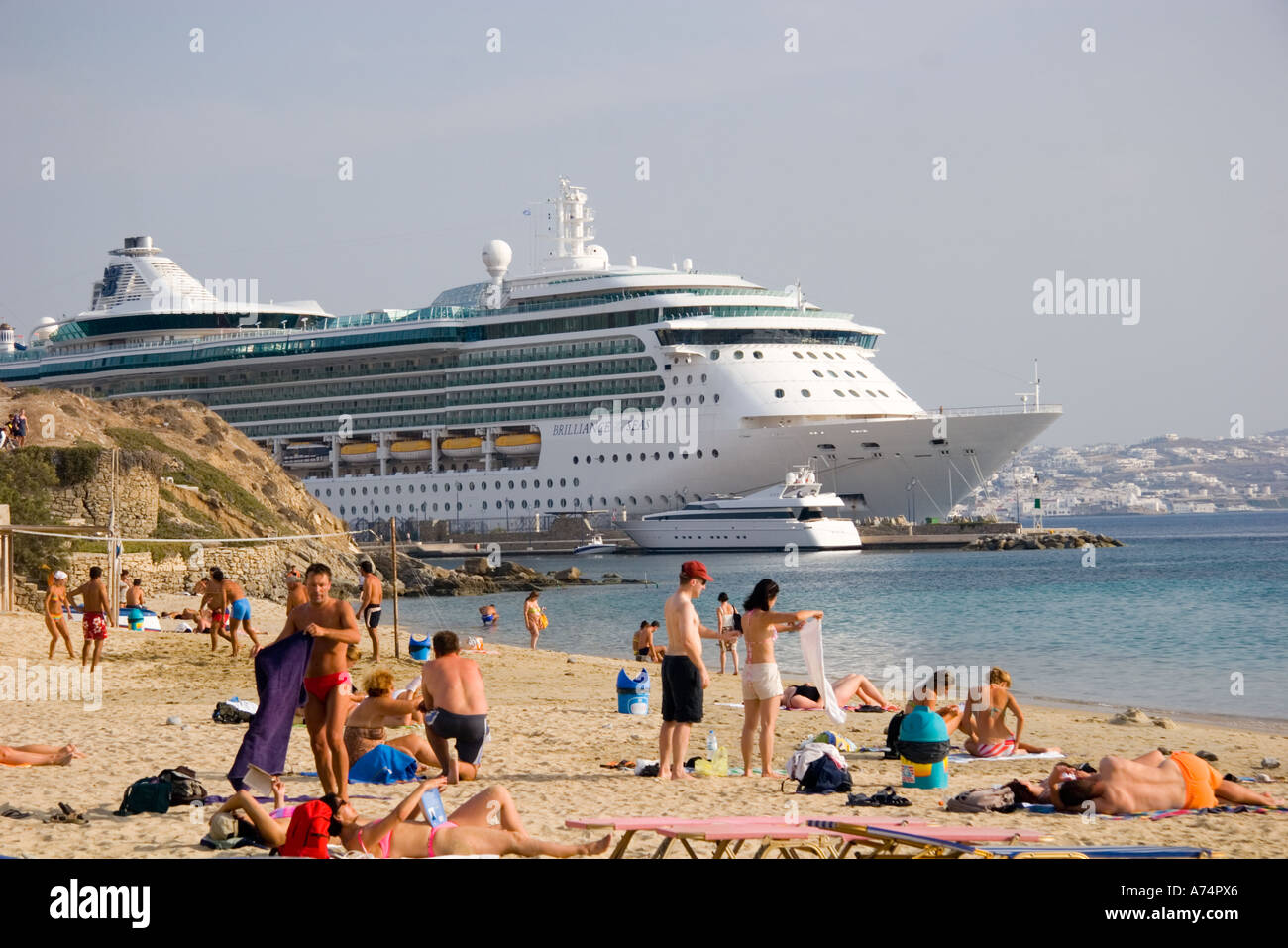 Cruise ship at Mykonos port Greece from Agios Stefanos beach Stock