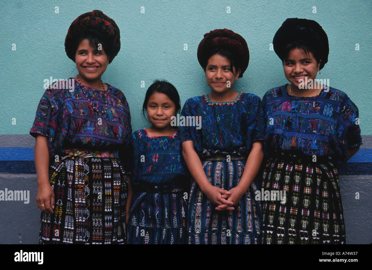 Guatemala, Panajachel. Mayan woman with three daughters wearing ...