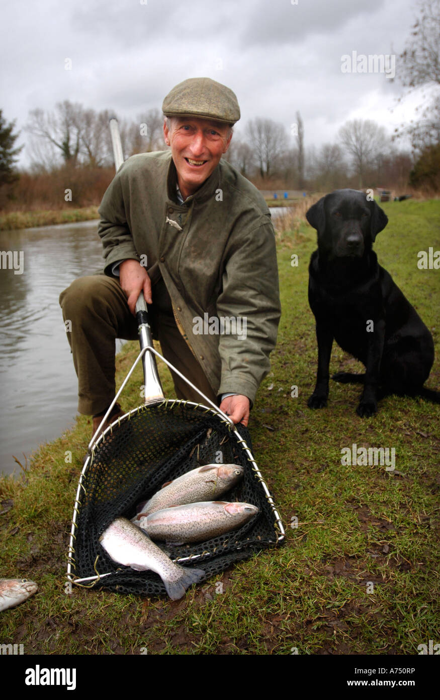 A FISH FARMER WITH TROUT SPECIMENS UK Stock Photo Alamy a-fish-farmer-with-trout-specimens-uk-stock-photo-alamy