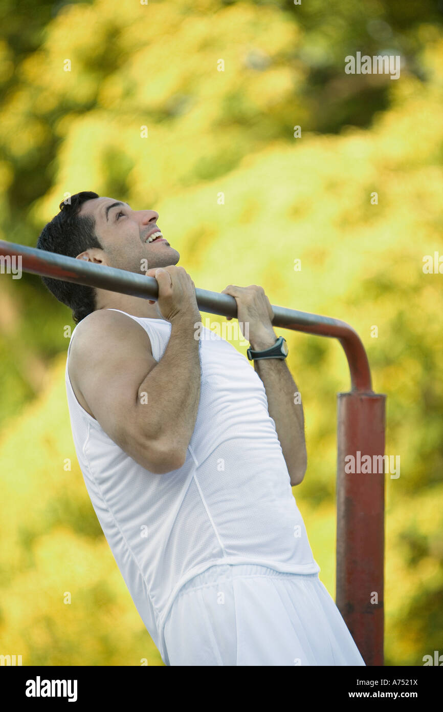 Man doing pullups outdoors Stock Photo Alamy