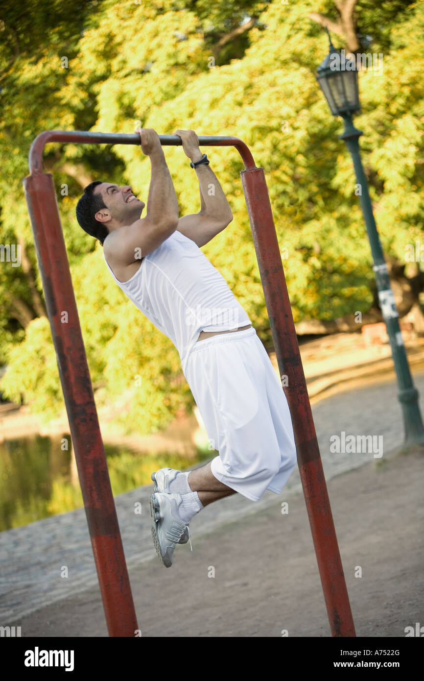 Man doing pullups outdoors Stock Photo Alamy