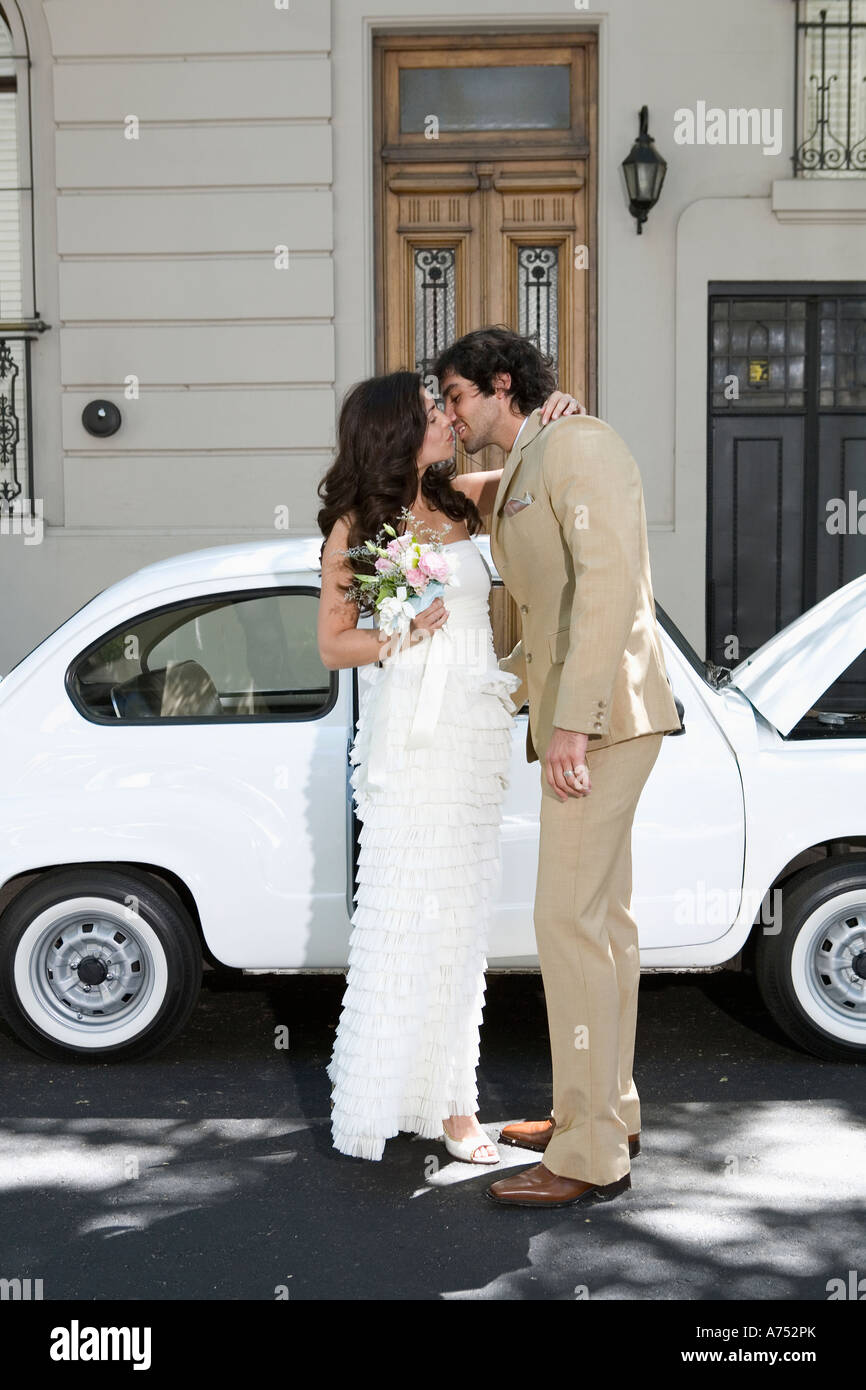 Newlywed couple kissing Stock Photo - Alamy