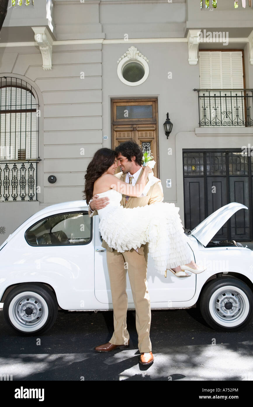Newlywed couple kissing Stock Photo - Alamy