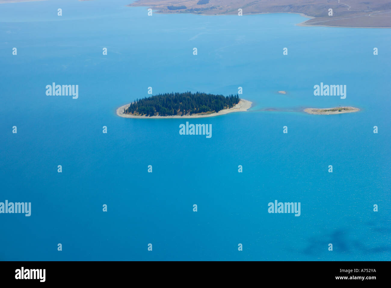 Aerial view of the island in the middle of lake Tekapo, south island ...