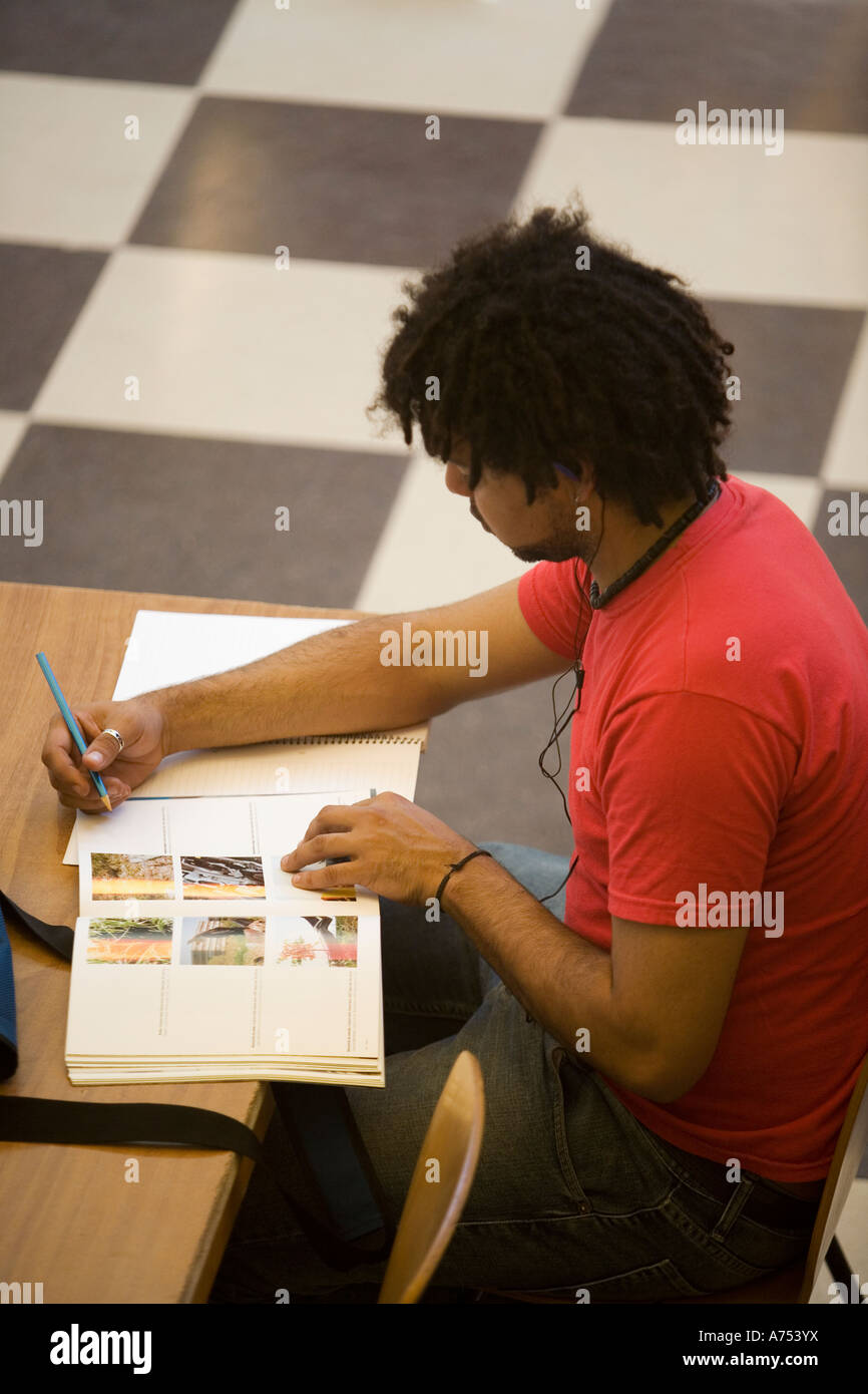 Man studying at desk Stock Photo - Alamy