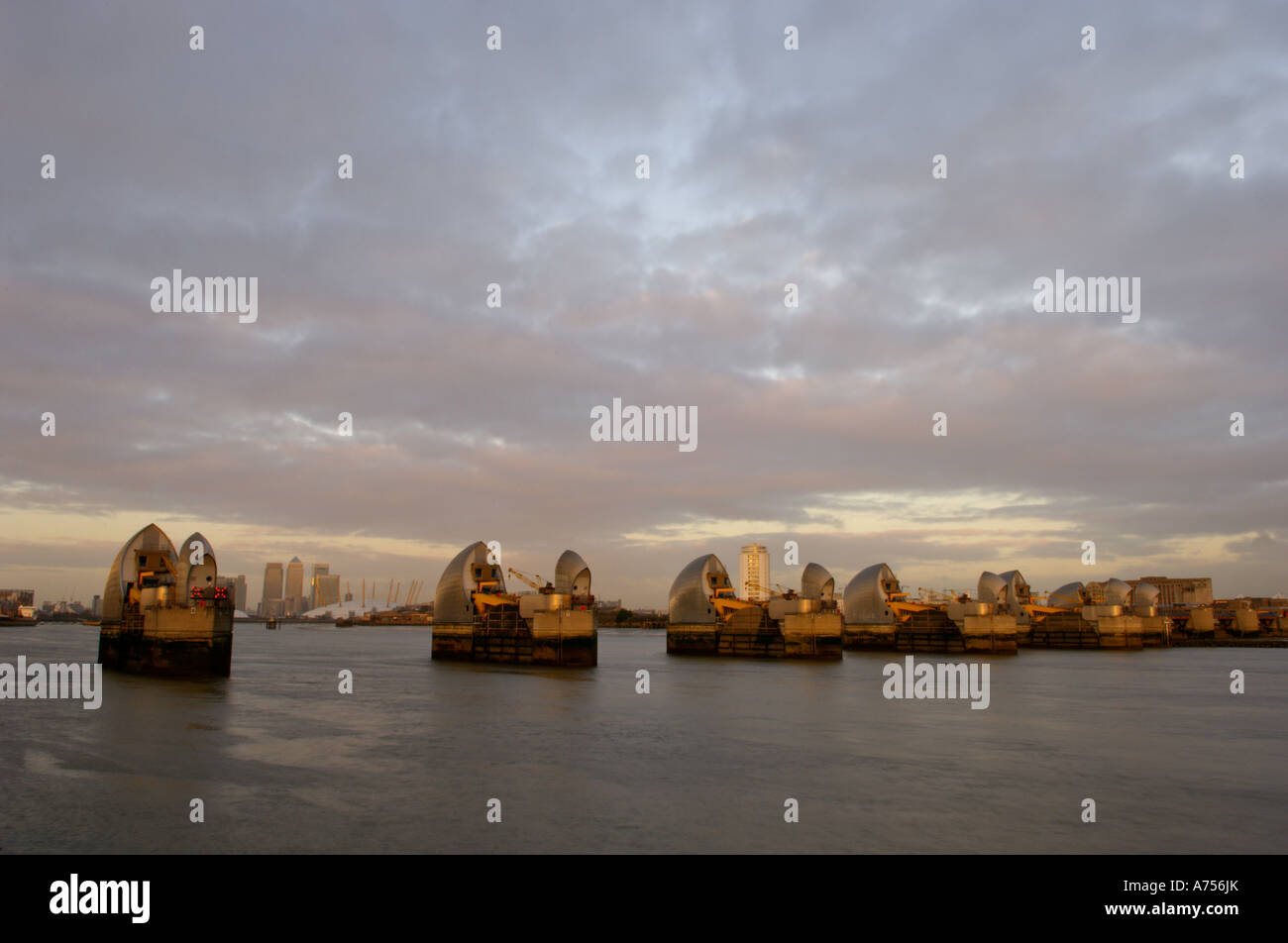 Moon rise and the Thames Barrier with Canary Wharf River Thames London ...