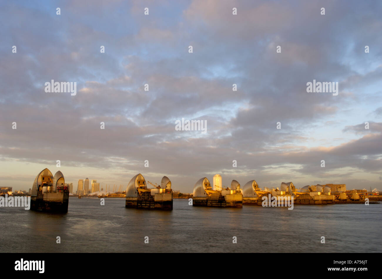 Moon rise and the Thames Barrier with Canary Wharf River Thames London ...