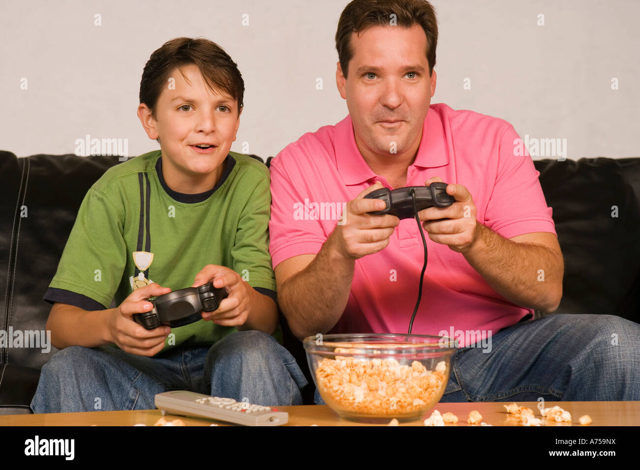 Father and son playing videogames Stock Photo Alamy
