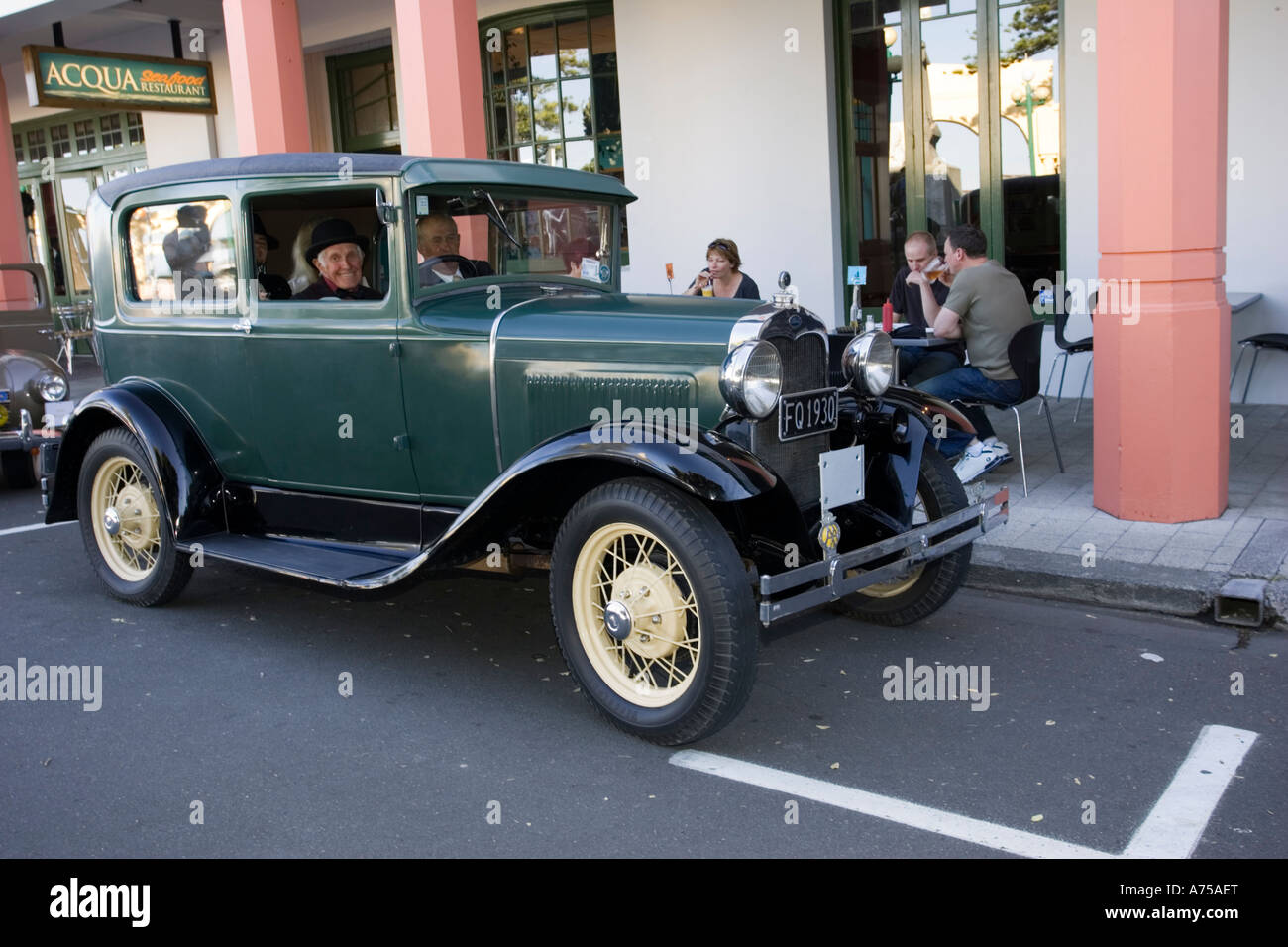 Classic vintage 1930 Ford green saloon motor car on road Art Deco weekend Napier North Island New Zealand Stock Photo