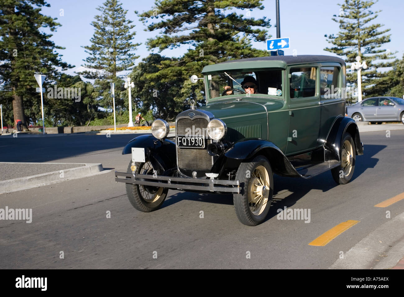 Classic vintage 1930 Ford green saloon motor car on road Art Deco weekend Napier North Island New Zealand Stock Photo