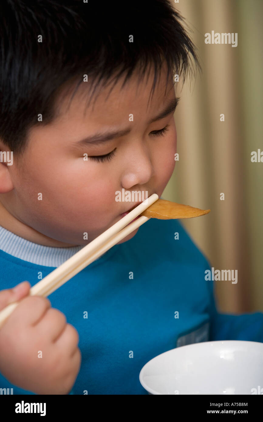 China boy eating chopsticks hires stock photography and images Alamy