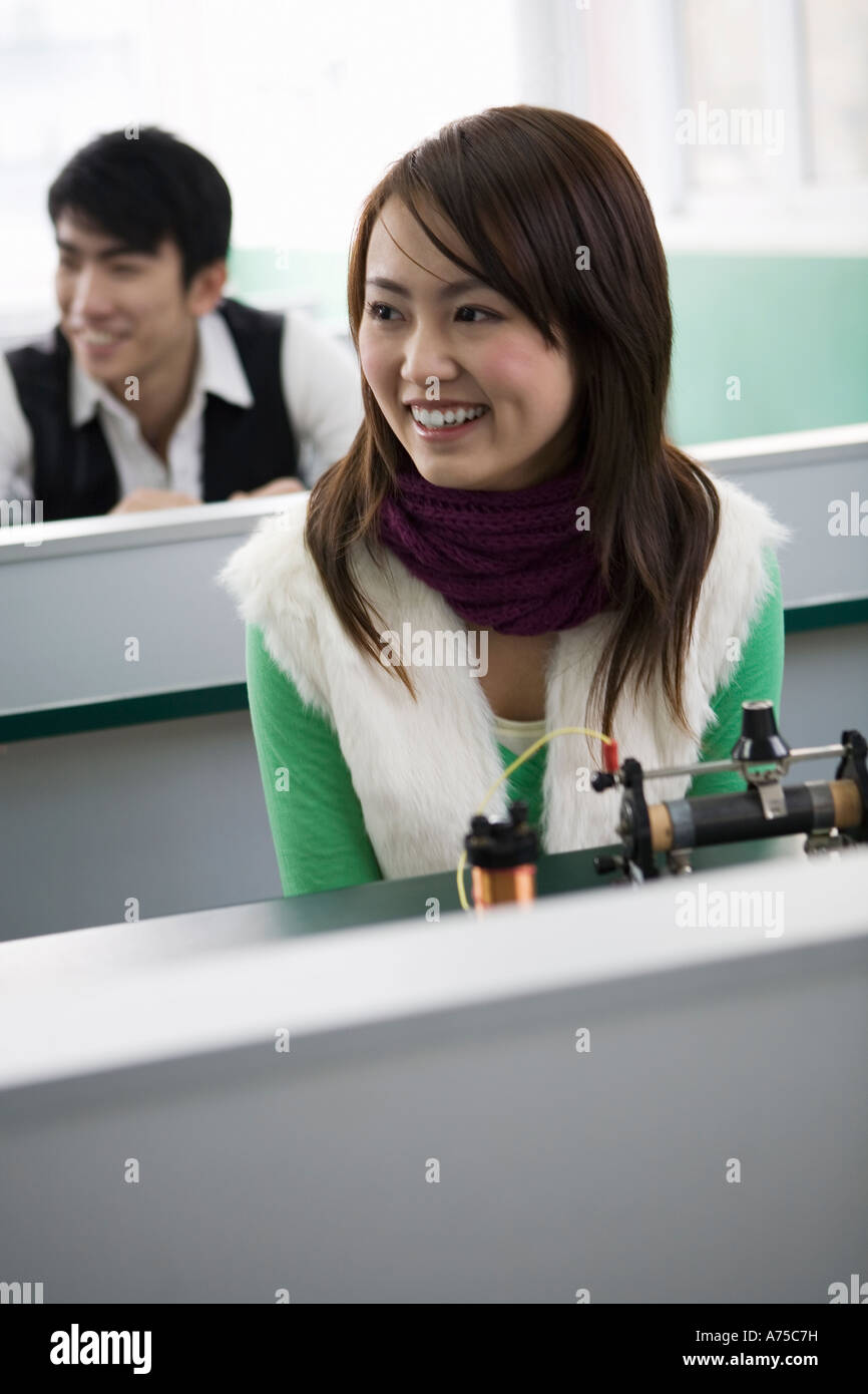 Student smiling at her desk Stock Photo - Alamy