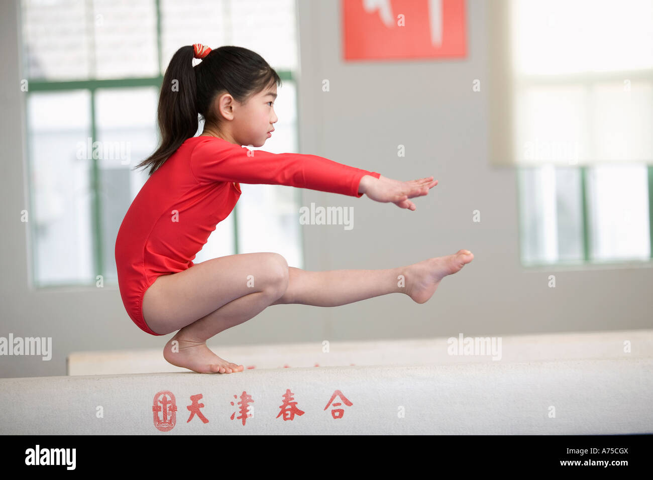 https://c8.alamy.com/comp/A75CGX/young-girl-practicing-gymnastics-A75CGX.jpg