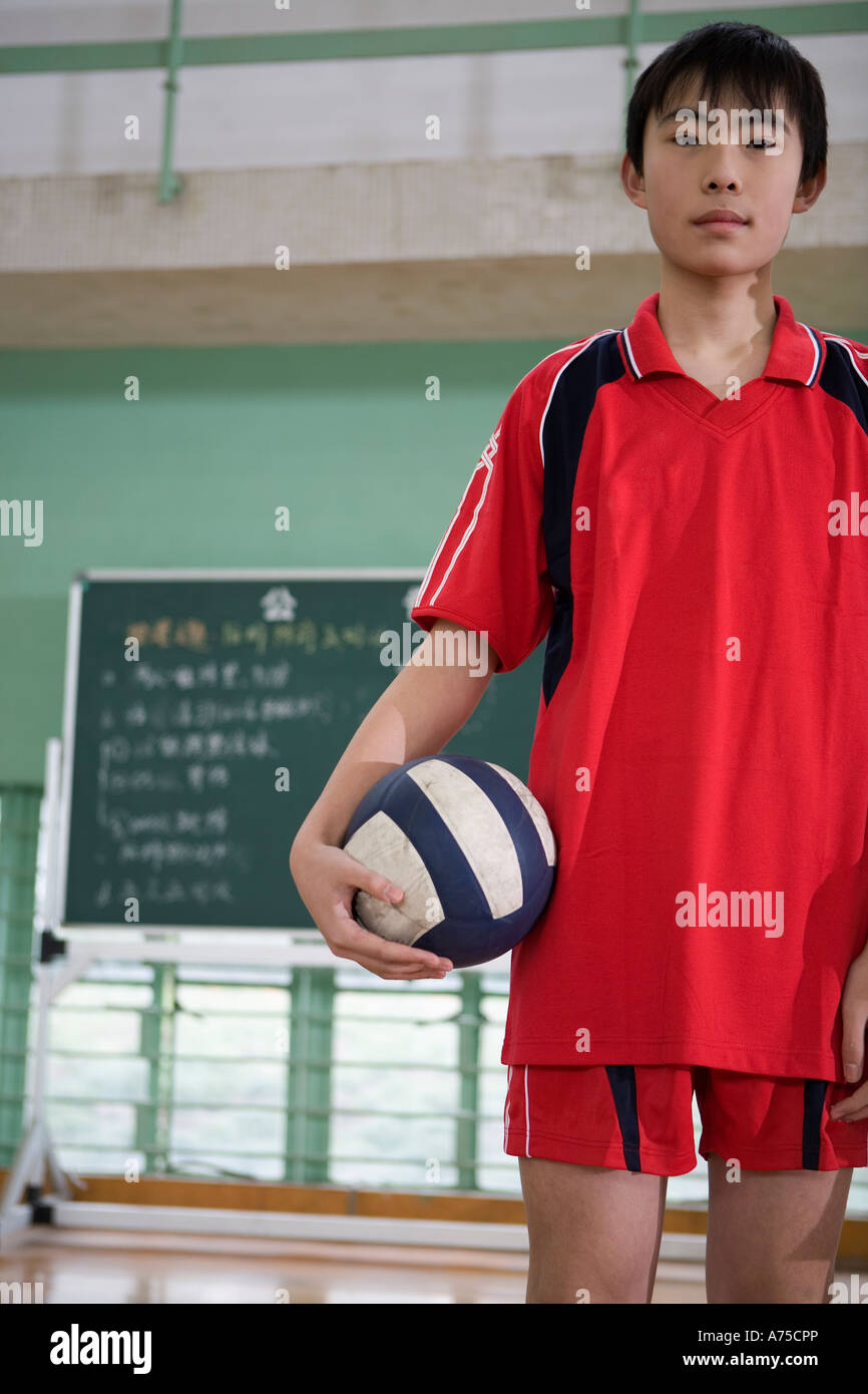 Male volleyball player holding volleyball Stock Photo Alamy