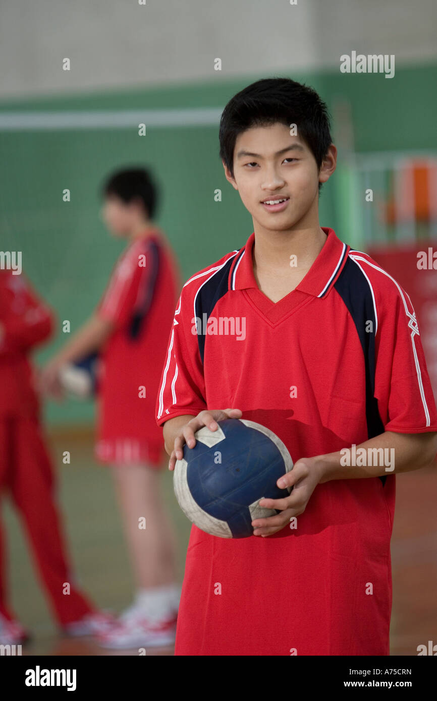 Male volleyball player holding volleyball Stock Photo