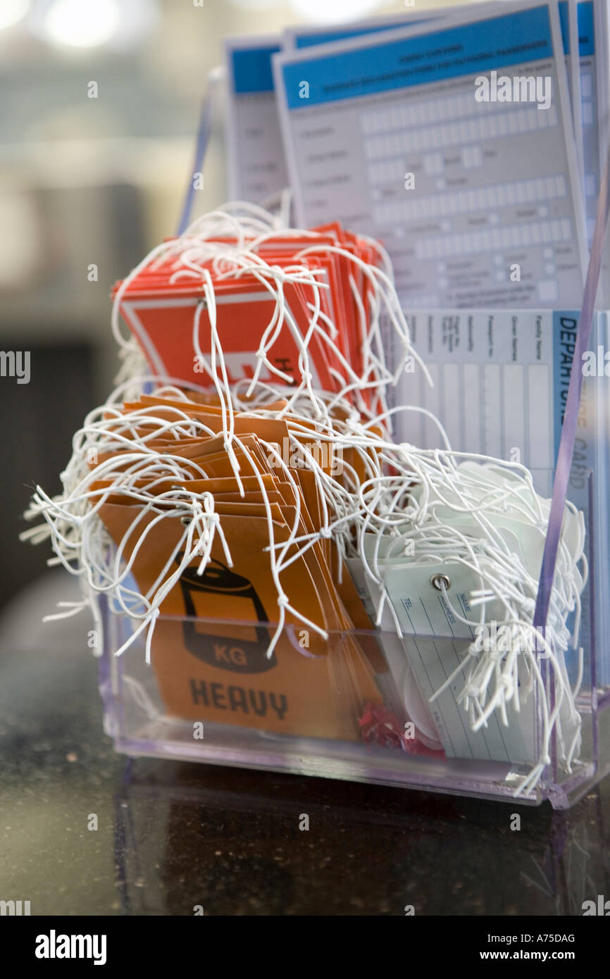 Luggage tags in airport Stock Photo Alamy